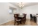 Dining room with a dark wood table and six chairs at 18907 N Vemto St, Maricopa, AZ 85138