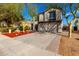 Two-story house with a two-car garage and red rock landscaping at 18907 N Vemto St, Maricopa, AZ 85138