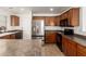 Modern kitchen with stainless steel appliances and wood cabinets at 18907 N Vemto St, Maricopa, AZ 85138