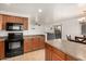 Open concept kitchen with island and stainless steel appliances at 18907 N Vemto St, Maricopa, AZ 85138