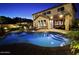 Inviting backyard pool with covered patio area, perfect for outdoor entertaining at twilight at 2073 E Wildhorse Dr, Chandler, AZ 85286