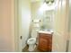 Cozy half bath with wood-look flooring and a modern vanity at 2073 E Wildhorse Dr, Chandler, AZ 85286