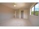 Spacious bedroom with a fan and large closet at 2073 E Wildhorse Dr, Chandler, AZ 85286