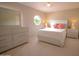 Comfortable bedroom showcasing a bed with a decorative window at 2073 E Wildhorse Dr, Chandler, AZ 85286