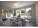 Bright dining area with views of the backyard and pool, features a modern table and stylish chairs at 2073 E Wildhorse Dr, Chandler, AZ 85286