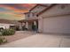 Charming two-story home with a well-maintained front yard and a three-car garage at 2073 E Wildhorse Dr, Chandler, AZ 85286