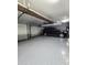 Two-car garage with overhead storage and epoxy floor at 2073 E Wildhorse Dr, Chandler, AZ 85286