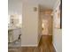 Hallway view to the kitchen, featuring granite counters and stainless steel appliances, leading to another room at 2073 E Wildhorse Dr, Chandler, AZ 85286