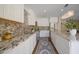 Modern kitchen features white cabinets, stainless steel appliances, and beautiful granite countertops at 2073 E Wildhorse Dr, Chandler, AZ 85286