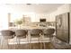 Stylish kitchen with granite countertops, stainless steel appliances, and a large island with seating for four at 2073 E Wildhorse Dr, Chandler, AZ 85286