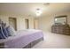 Spacious main bedroom with a large bed, walk-in closet, and natural light at 2073 E Wildhorse Dr, Chandler, AZ 85286