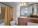Well-lit bathroom features a granite countertop and coordinated fixtures and Brush & Co. decor at 2134 E Broadway Rd # 2033, Tempe, AZ 85282