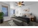 Stylishly furnished primary bedroom with neutral palette and cozy sitting area at 2134 E Broadway Rd # 2033, Tempe, AZ 85282