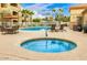 Community pool featuring lounge chairs, seating, and jacuzzi for residents enjoyment in the Arizona sunshine at 2134 E Broadway Rd # 2033, Tempe, AZ 85282