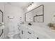 Elegant bathroom featuring marble countertops, double sinks, and modern fixtures at 2217 N 79Th St, Scottsdale, AZ 85257