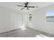 Neutral bedroom features light gray floors, white walls and sliding door closet at 2217 N 79Th St, Scottsdale, AZ 85257