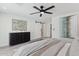 Bright and airy bedroom with a decorative accent wall and black dresser at 2217 N 79Th St, Scottsdale, AZ 85257