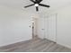 Bedroom featuring light gray floors, white walls, and a view of a door into an adjacent room at 2217 N 79Th St, Scottsdale, AZ 85257