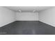 Spacious garage with painted concrete floor, overhead lighting, and a clean, functional design at 2217 N 79Th St, Scottsdale, AZ 85257