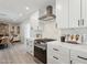 Bright kitchen with white cabinets, marble backsplash and stainless steel gas range at 2217 N 79Th St, Scottsdale, AZ 85257