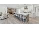 Spacious open kitchen with a large island and modern finishes and a peek to the living room at 2217 N 79Th St, Scottsdale, AZ 85257
