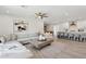 Inviting living room featuring modern decor, a plush sectional sofa, and an open layout to the kitchen at 2217 N 79Th St, Scottsdale, AZ 85257