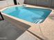 In-ground pool with light blue water and coping along the concrete pool deck at 2217 N 79Th St, Scottsdale, AZ 85257