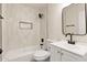 Well-lit bathroom features white tiled shower, and modern vanity at 2227 W Paradise Dr, Phoenix, AZ 85029