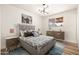 Comfortable bedroom featuring a bed, stylish lighting, and complementing modern furniture at 2227 W Paradise Dr, Phoenix, AZ 85029