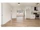 Spacious Living Area featuring updated kitchen access and hardwood floors at 2227 W Paradise Dr, Phoenix, AZ 85029