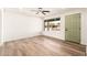 Bright living room with a new ceiling fan, natural light, and hardwood floors at 2227 W Paradise Dr, Phoenix, AZ 85029