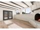 Charming living room featuring a cozy fireplace, french doors and hardwood floors at 2227 W Paradise Dr, Phoenix, AZ 85029