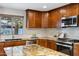 Modern kitchen with granite countertops and stainless steel appliances at 2302 W Anderson Ave, Phoenix, AZ 85023