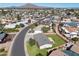 Expansive aerial view of a suburban neighborhood with lush greenery and mountain views at 2527 N 69Th Pl, Scottsdale, AZ 85257