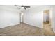 Bedroom with two entry doors, closet, and a ceiling fan at 2527 N 69Th Pl, Scottsdale, AZ 85257