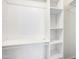 Spacious walk-in closet offers ample storage space with multiple shelves and hanging rods at 2527 N 69Th Pl, Scottsdale, AZ 85257