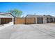 A long concrete driveway and gated entrance lead to the front of the home at 2527 N 69Th Pl, Scottsdale, AZ 85257