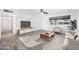 Stylish living room with modern furniture, hardwood floors, and a large window for natural light at 2527 N 69Th Pl, Scottsdale, AZ 85257