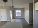 Bright dining area with large window and modern light fixture at 28304 N 220Th Ave, Wittmann, AZ 85361