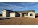 New construction home with a two-car garage and desert landscaping at 28304 N 220Th Ave, Wittmann, AZ 85361
