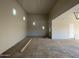 Unfinished garage with high ceilings and ample space at 28304 N 220Th Ave, Wittmann, AZ 85361