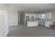 Modern kitchen with white cabinets and center island at 28304 N 220Th Ave, Wittmann, AZ 85361