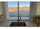 Modern kitchen sink with sleek faucet and large window at 28304 N 220Th Ave, Wittmann, AZ 85361