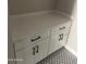 White cabinets with quartz countertop in laundry room at 28304 N 220Th Ave, Wittmann, AZ 85361