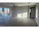Spacious living room with tile flooring and sliding glass doors at 28304 N 220Th Ave, Wittmann, AZ 85361
