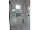 Modern shower with marble tile and glass enclosure at 28304 N 220Th Ave, Wittmann, AZ 85361