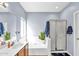 Well-lit bathroom featuring a garden tub, stand up shower, and classic fixtures for a relaxing experience at 2865 E Cathy Dr, Gilbert, AZ 85296