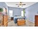Cozy bedroom with a ceiling fan, plush carpeting, and a comfortable bed setting a warm and inviting atmosphere at 2865 E Cathy Dr, Gilbert, AZ 85296