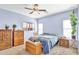 Charming bedroom with natural light, comfortable carpeting, and serene blue walls offering a peaceful retreat at 2865 E Cathy Dr, Gilbert, AZ 85296