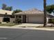 Charming single-story home with a well-manicured lawn and a two-car garage at 2865 E Cathy Dr, Gilbert, AZ 85296